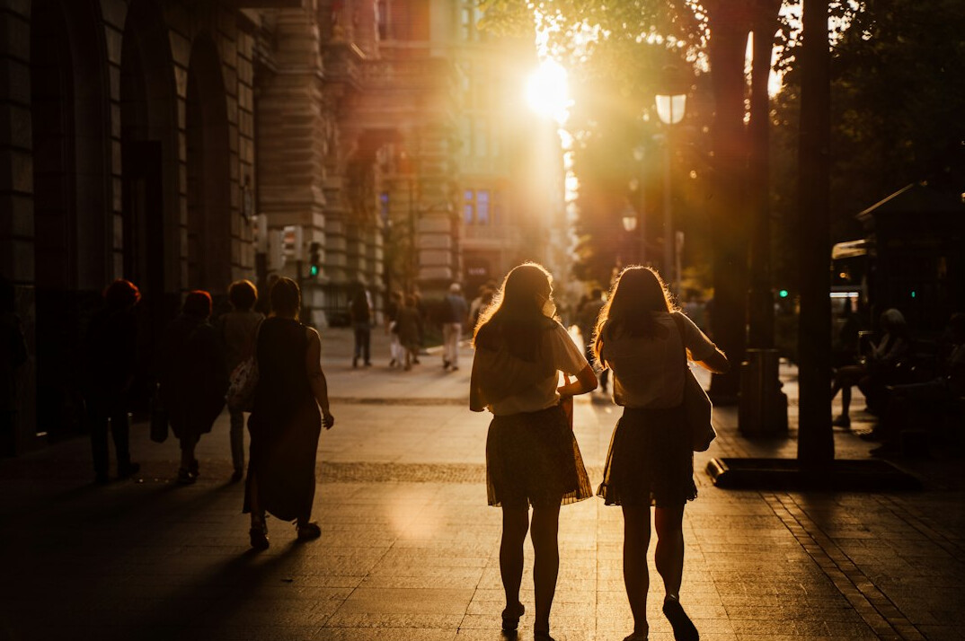 Couple walking together on a Chilean city sidewalk