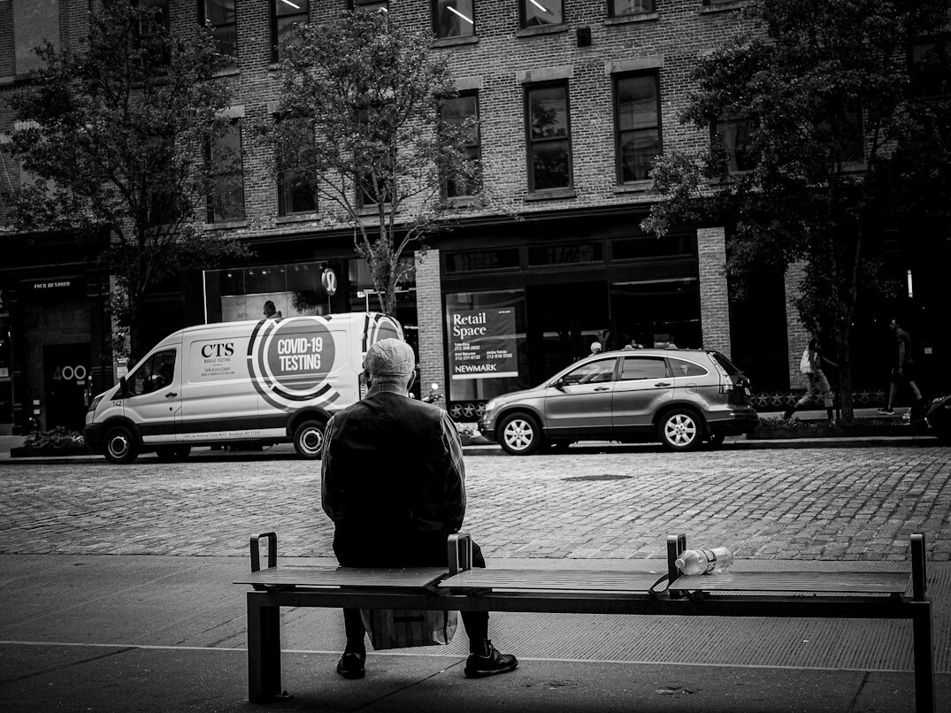 Elderly Chilean man sitting on a park bench