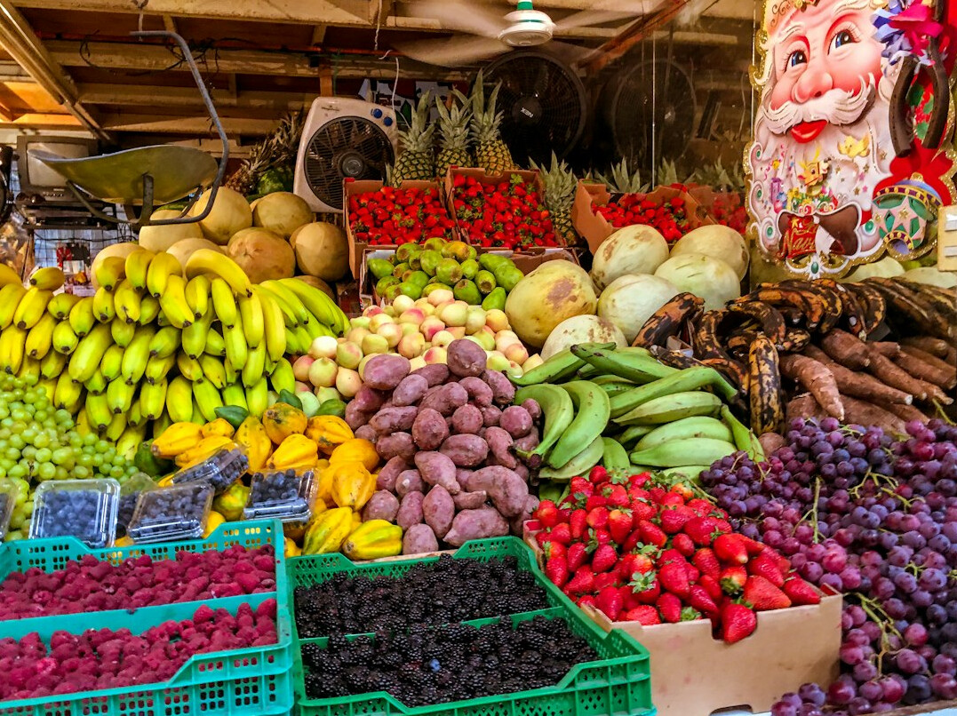Chilean woman selling fruit at a market stall